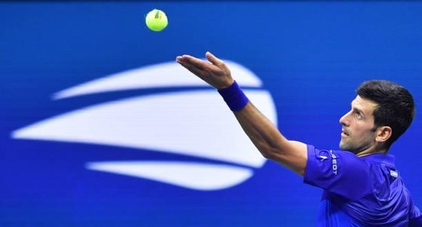 Serbia's Novak Djokovic serves to Denmark's Holger Rune during their 2021 US Open Tennis tournament men's singles first round match at the USTA...