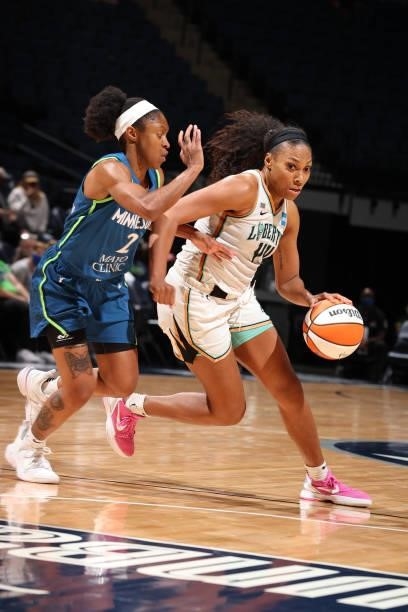 Crystal Dangerfield of the Minnesota Lynx plays defense on Betnijah Laney of the New York Liberty during the game on August 31, 2021 at Target Center...
