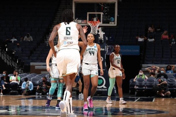 Betnijah Laney of the New York Liberty high-fives teammates during the game against the Minnesota Lynx on August 31, 2021 at Target Center in...