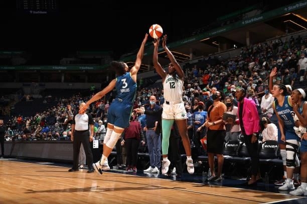 Michaela Onyenwere of the New York Liberty shoots a three-point basket during the game against the Minnesota Lynx on August 31, 2021 at Target Center...