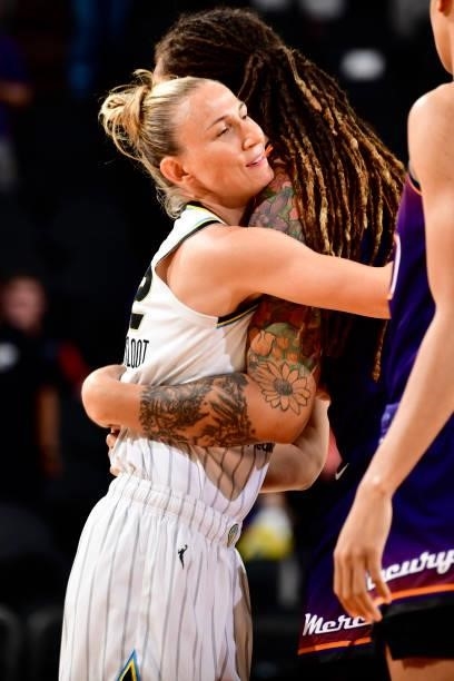 Courtney Vandersloot of the Chicago Sky hugs a Phoenix Mercury player before the game on August 31, 2021 at Footprint Center in Phoenix, Arizona....