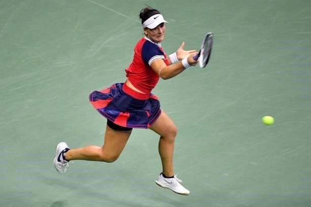 Canada's Bianca Andreescu hits a return to Switzerland's Viktorija Golubic during their 2021 US Open Tennis tournament women's singles first round...