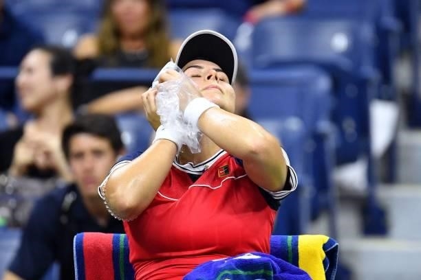 Canada's Bianca Andreescu ices her face during her 2021 US Open Tennis tournament women's singles first round match against Switzerland's Viktorija...