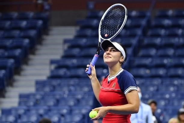 Canada's Bianca Andreescu prepares to throw balls to spectators after defeating Switzerland's Viktorija Golubic during their 2021 US Open Tennis...