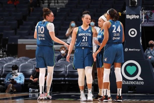 Kayla McBride of the Minnesota Lynx smiles with teammates during the game against the New York Liberty on August 31, 2021 at Target Center in...