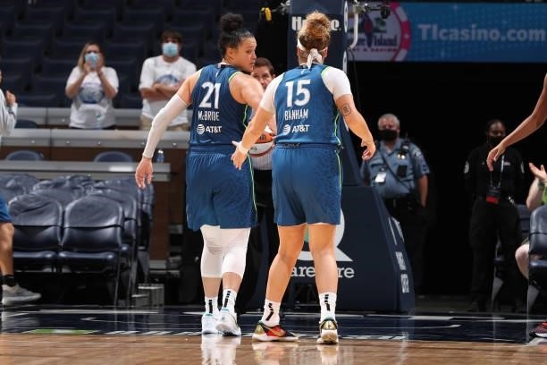 Kayla McBride of the Minnesota Lynx high-fives teammate Rachel Banham during the game against the New York Liberty on August 31, 2021 at Target...