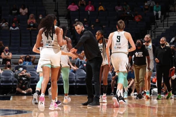 Head Coach Walt Hopkins of the New York Liberty high-fives players during the game against the Minnesota Lynx on August 31, 2021 at Target Center in...