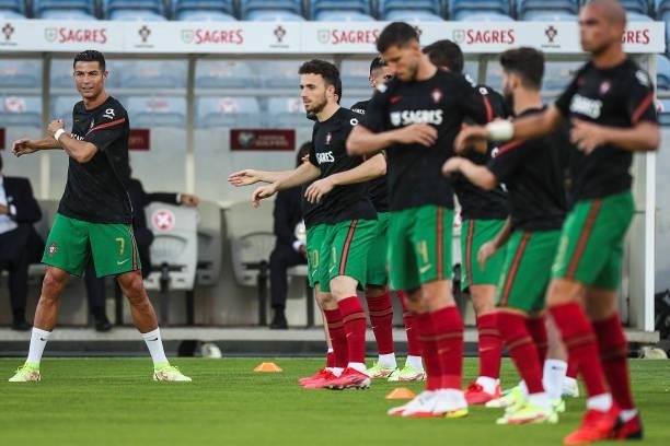 Portugal's forward Cristiano Ronaldo warms up with teammates before the FIFA World Cup Qatar 2022 European qualifying round group A football match...