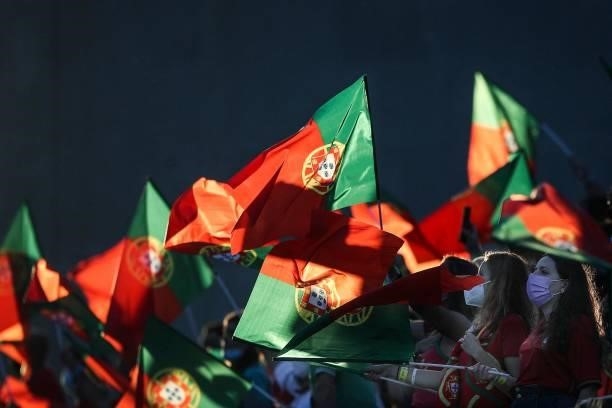 Supporters wave flags of Portugal during the FIFA World Cup Qatar 2022 European qualifying round group A football match between Portugal and Republic...