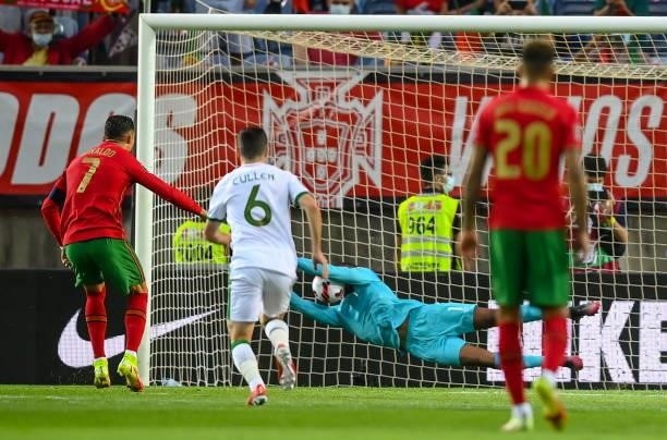 Faro , Portugal - 1 September 2021; Republic of Ireland goalkeeper Gavin Bazunu saves the penalty of Cristiano Ronaldo of Portugal during the FIFA...