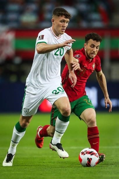 Republic of Ireland's defender Dara Oshea fights for the ball with Portugal's forward Diogo Jota during the FIFA World Cup Qatar 2022 European...