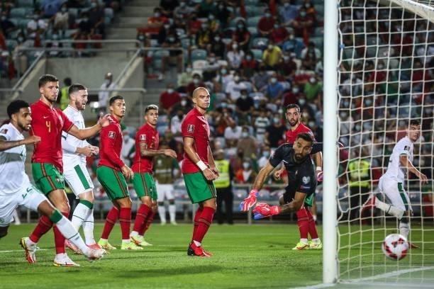 Republic of Ireland's defender John Egan scores a goal during the FIFA World Cup Qatar 2022 European qualifying round group A football match between...