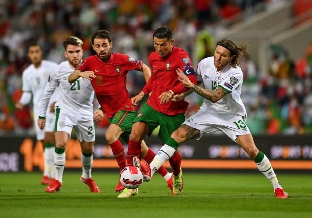 Faro , Portugal - 1 September 2021; Cristiano Ronaldo of Portugal in action against Jeff Hendrick of Republic of Ireland during the FIFA World Cup...