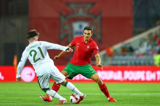 Aaron Connolly of Republic of Ireland and Brighton tries to pass trough Joao Palhinha of Sporting CP and Portugal during the 2022 FIFA World Cup...