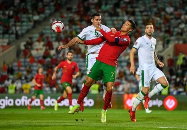 Faro , Portugal - 1 September 2021; Cristiano Ronaldo of Portugal in action against Josh Cullen of Republic of Ireland during the FIFA World Cup 2022...