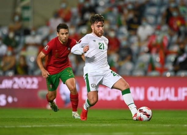 Faro , Portugal - 1 September 2021; Aaron Connolly of Republic of Ireland in action against Raphael Guerreiro of Portugal during the FIFA World Cup...