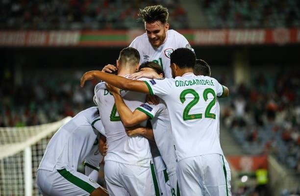 Faro , Portugal - 1 September 2021; Republic of Ireland players celebrate after their first goal, scored by John Egan, hidden, during the FIFA World...