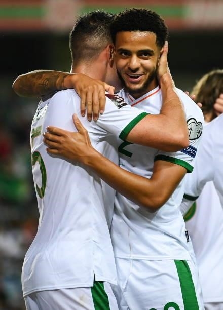 Faro , Portugal - 1 September 2021; John Egan of Republic of Ireland celebrates with team-mate Andrew Omobamidele, right, after scoring his side's...
