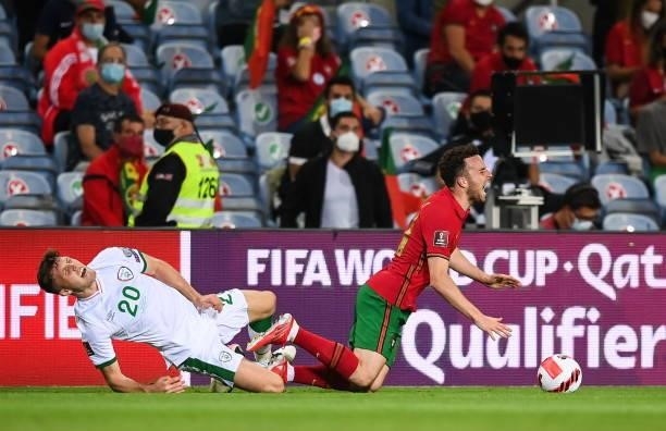 Faro , Portugal - 1 September 2021; Dara O'Shea of Republic of Ireland in action against Diogo Jota of Portugal during the FIFA World Cup 2022...