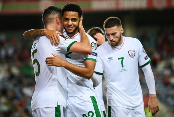 Faro , Portugal - 1 September 2021; John Egan of Republic of Ireland celebrates with team-mate Andrew Omobamidele, right, after scoring his side's...