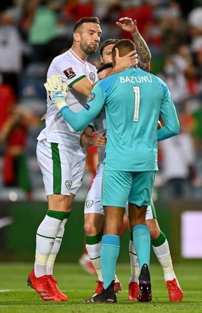 Faro , Portugal - 1 September 2021; Gavin Bazunu of Republic of Ireland is congratulated by team-mate Shane Duffy after saving a penalty from...