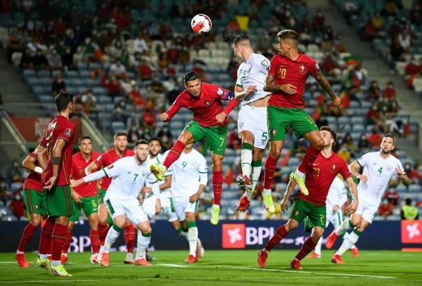 Faro , Portugal - 1 September 2021; John Egan of Republic of Ireland heads to score his side's first goal during the FIFA World Cup 2022 qualifying...