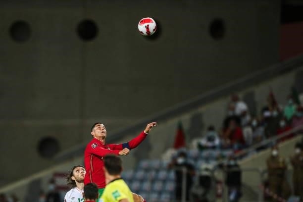 Portugal's forward Cristiano Ronaldo fights for the ball with Republic of Ireland's midfielder Jeff Hendrick during the FIFA World Cup Qatar 2022...