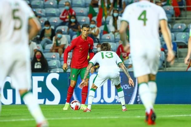 Cristiano Ronaldo of Manchester United and Portugal tries to pass trough Jeff Hendrick of Republic of Ireland and Newcastle United during the 2022...