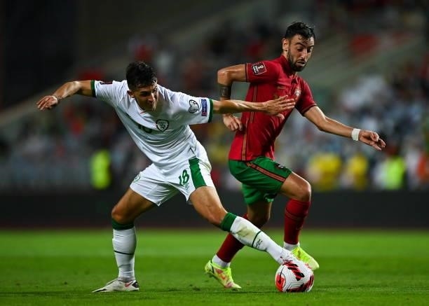 Faro , Portugal - 1 September 2021; Jamie McGrath of Republic of Ireland in action against Bruno Fernandes of Portugal during the FIFA World Cup 2022...