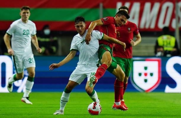 Jamie McGrath of Republic of Ireland and St. Mirren with Joao Palhinha of Sporting CP and Portugal in action during the World Cup 2022 Qualifier...
