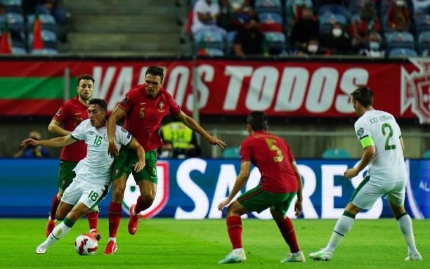 Jamie McGrath of Republic of Ireland and St. Mirren with Joao Palhinha of Sporting CP and Portugal in action during the World Cup 2022 Qualifier...