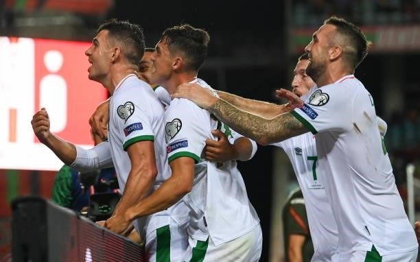 Faro , Portugal - 1 September 2021; John Egan, left, celebrates with Republic of Ireland team-mates, from second from left, Jamie McGrath, Matt...