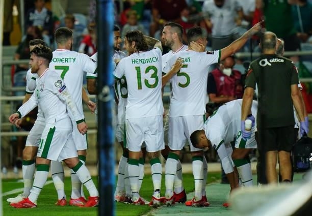 John Egan of Republic of Ireland and Sheffield United celebrates with teammates after scoring a goal during the World Cup 2022 Qualifier match...