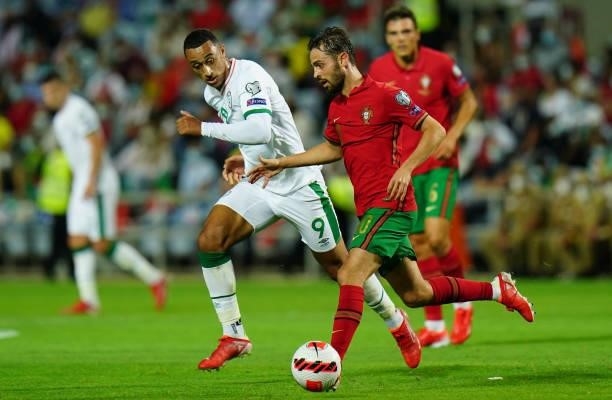 Bernardo Silva of Manchester City and Portugal with Adam Idah of Republic of Ireland and Norwich City in action during the World Cup 2022 Qualifier...