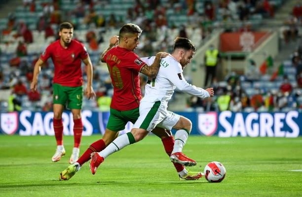 Faro , Portugal - 1 September 2021; Aaron Connolly of Republic of Ireland is tackled by João Cancelo of Portugal during the FIFA World Cup 2022...