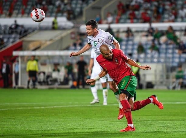 Faro , Portugal - 1 September 2021; Josh Cullen of Republic of Ireland in action against Pepe of Portugal during the FIFA World Cup 2022 qualifying...