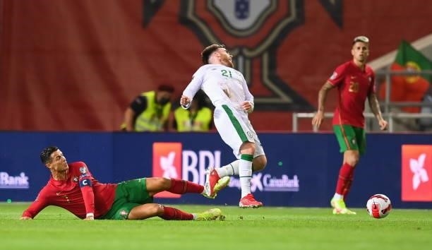 Faro , Portugal - 1 September 2021; Cristiano Ronaldo of Portugal tackled Aaron Connolly of Republic of Ireland during the FIFA World Cup 2022...