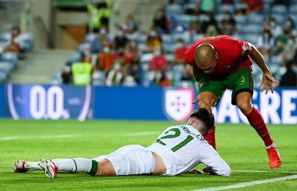 Faro , Portugal - 1 September 2021; Pepe of Portugal remonstrates toward Aaron Connolly of Republic of Ireland after going down in the box during the...