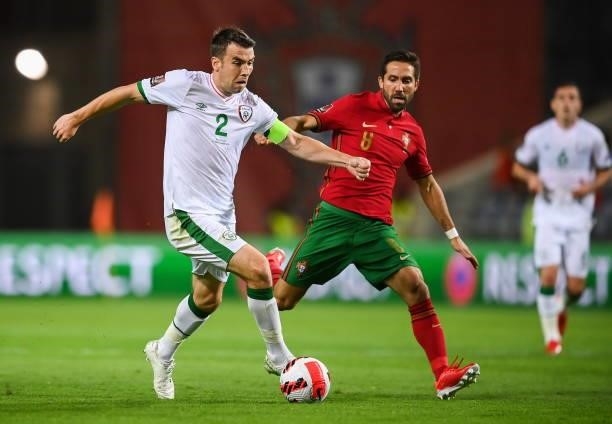 Faro , Portugal - 1 September 2021; Seamus Coleman of Republic of Ireland in action against João Moutinho of Portugal during the FIFA World Cup 2022...