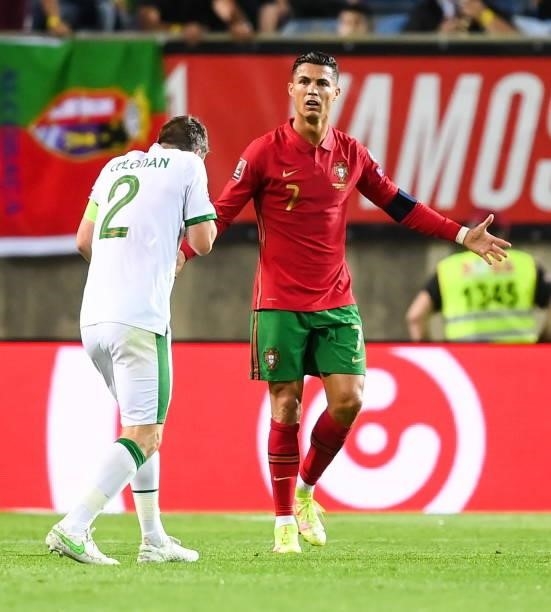 Faro , Portugal - 1 September 2021; Seamus Coleman of Republic of Ireland in conversation with Cristiano Ronaldo of Portugal during the FIFA World...