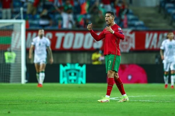 Cristiano Ronaldo of Manchester United and Portugal celebrates scoring Portugal's first goal during the 2022 FIFA World Cup Qualifier match between...