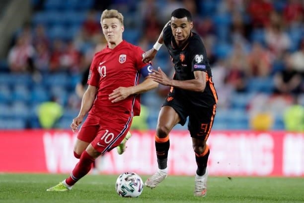 Martin Odegaard of Norway, Cody Gakpo of Holland during the World Cup Qualifier match between Norway v Holland at the Ullevaal Stadium on September...