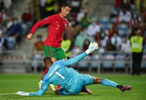 Faro , Portugal - 1 September 2021; Cristiano Ronaldo of Portugal in action against Republic of Ireland goalkeeper Gavin Bazunu during the FIFA World...