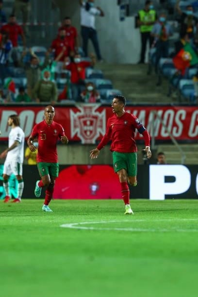 Cristiano Ronaldo of Manchester United and Portugal celebrates scoring Portugal's first goal during the 2022 FIFA World Cup Qualifier match between...