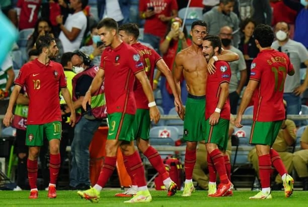 Cristiano Ronaldo of Manchester United and Portugal celebrates with teammates after scoring a goal during the World Cup 2022 Qualifier match between...