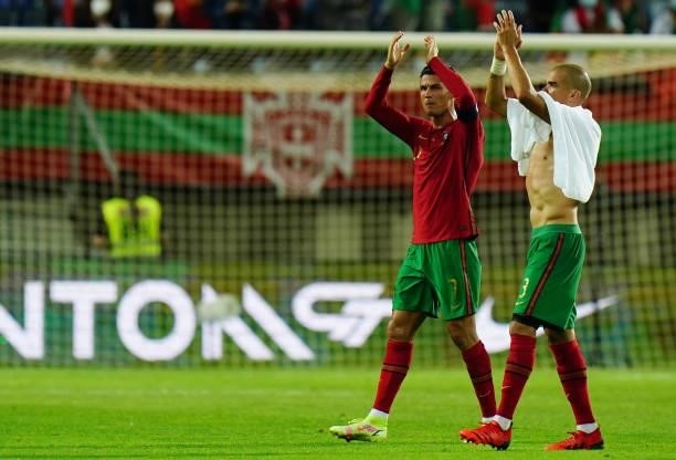 Goal scorer Cristiano Ronaldo of Manchester United and Portugal celebrates the victory with teammate Pepe of FC Porto and Portugal at the end of the...