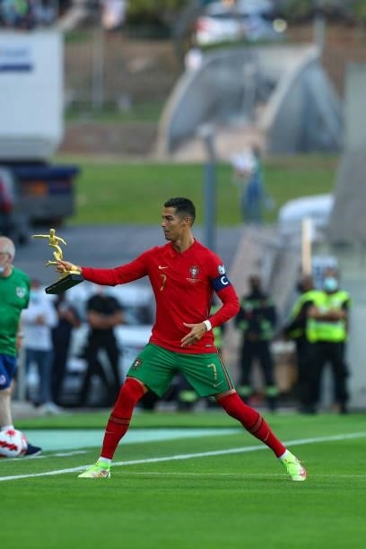 Cristiano Ronaldo of Manchester United and Portugal with the trophy of Best Goal Score of Euro 2020 during the 2022 FIFA World Cup Qualifier match...