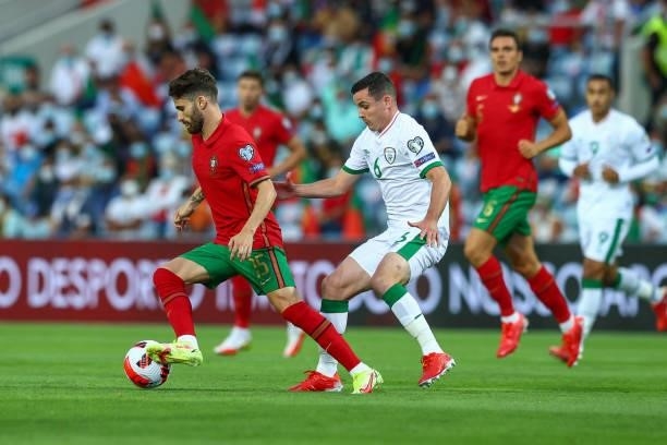 Rafa Silva of SL Benfica and Portugal tries to escape Josh Cullen of Republic of Ireland and Anderlecht during the 2022 FIFA World Cup Qualifier...