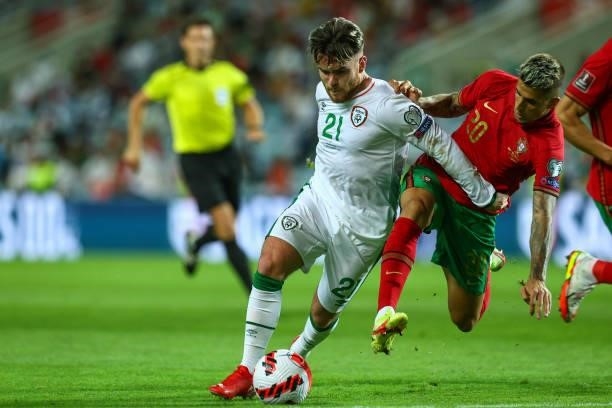 Aaron Connolly of Republic of Ireland and Brighton vies with Joao Cancelo of Manchester City and Portugal for the ball possession during the 2022...