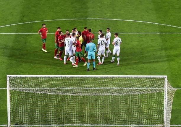 Faro , Portugal - 1 September 2021; Players from both sides tussle during the FIFA World Cup 2022 qualifying group A match between Portugal and...